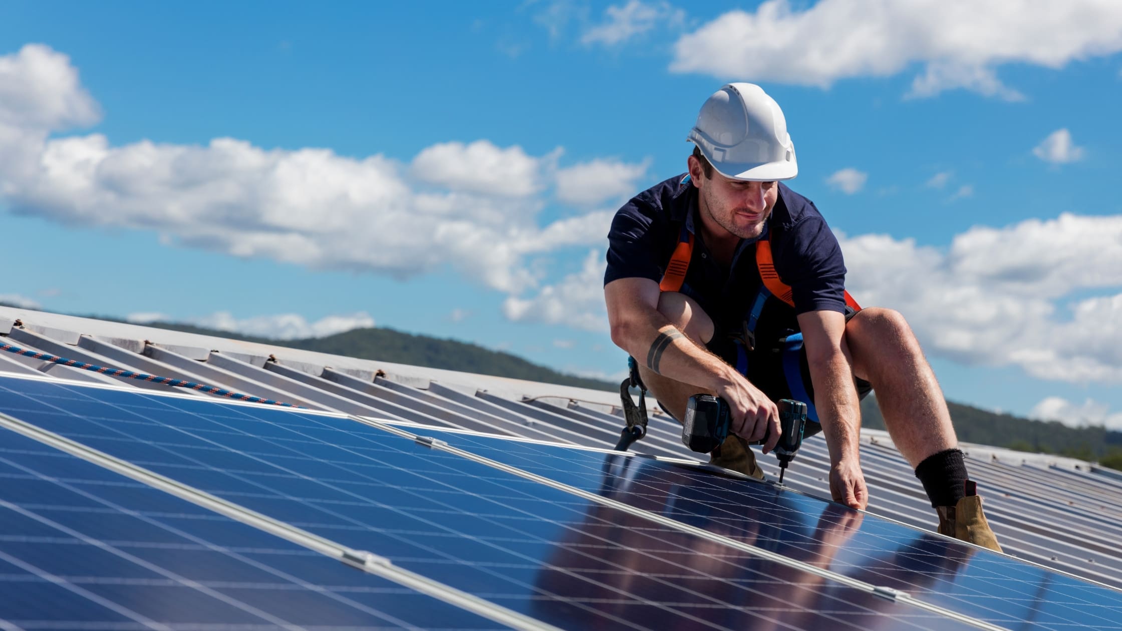 ECO4 Grant (Blog Banner) technician installing solar panels