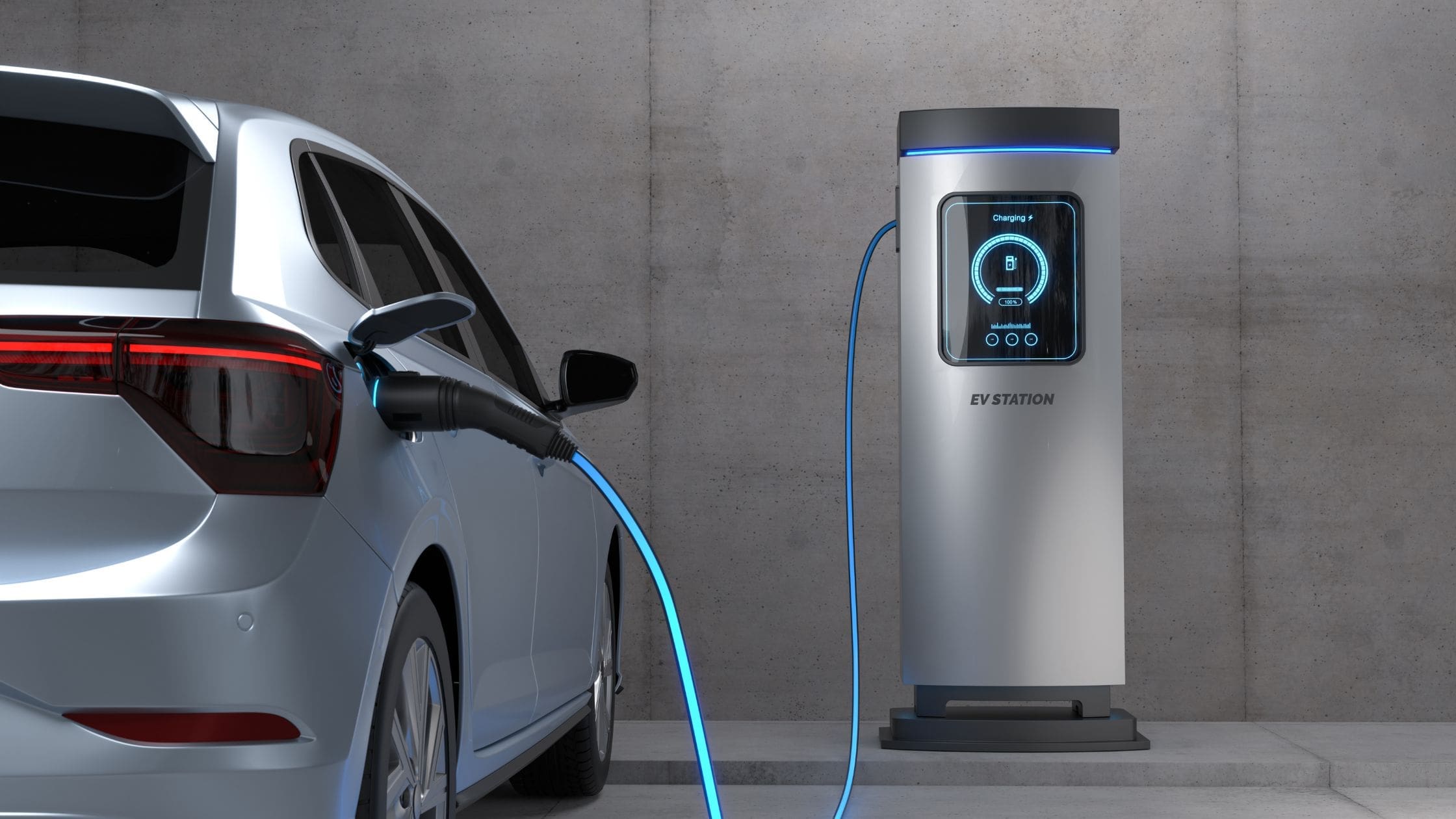 Silver car, tower EV Charger