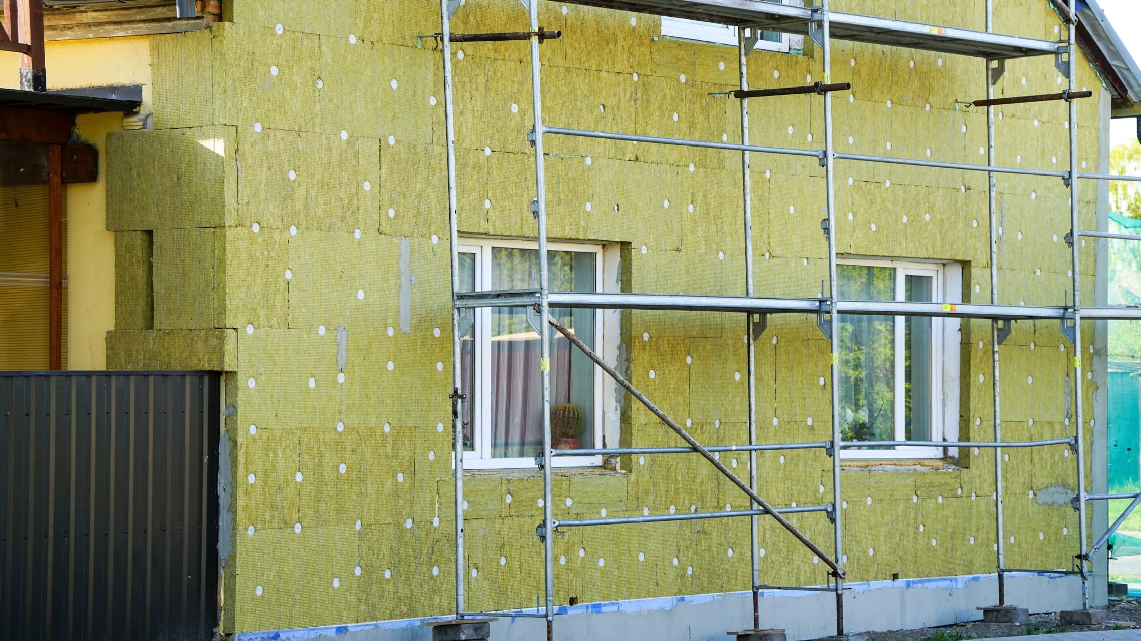 External Wall Insulation Benefits (Blog Banner) external wall insulation on a house