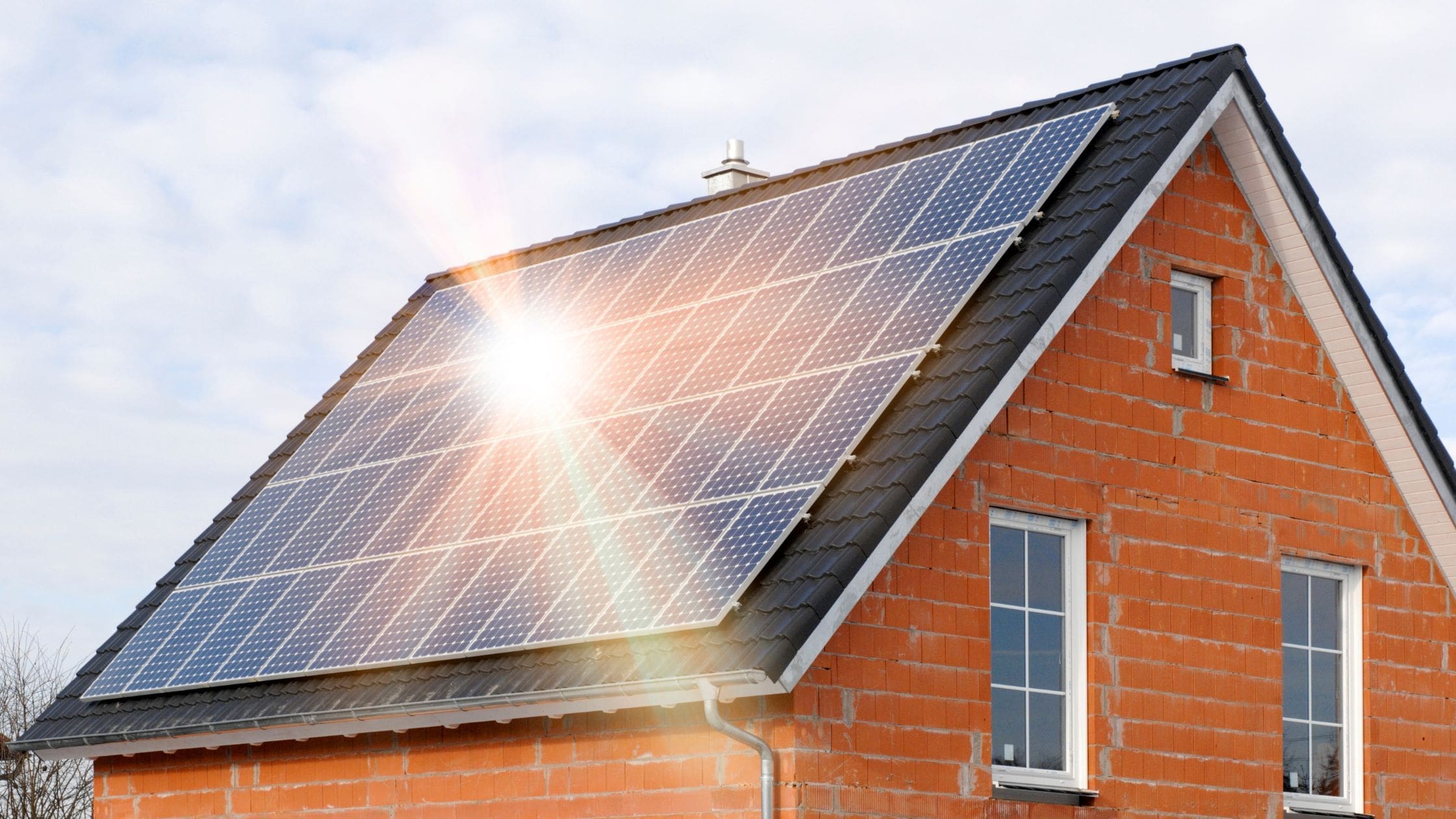 Understanding the Lifespan of Solar Panels (Blog Banner) house with solar panels